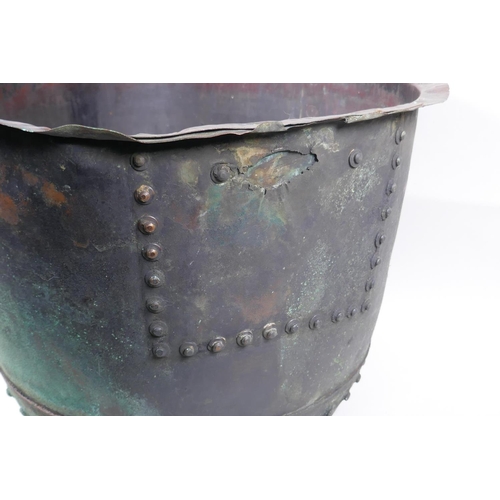 18 - An antique riveted copper bin, with historic repair, 36cm high, 50cm diameter