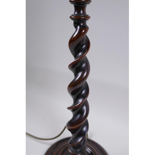 22 - A mahogany barley twist lamp, 56cm high