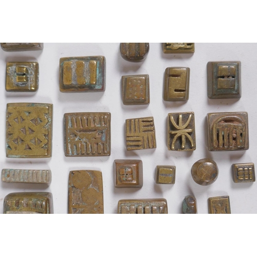 3 - A collection of African bronze Ashanti gold weights with unique design, and a set of gold scales, AF