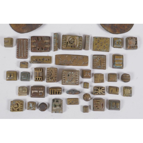 3 - A collection of African bronze Ashanti gold weights with unique design, and a set of gold scales, AF