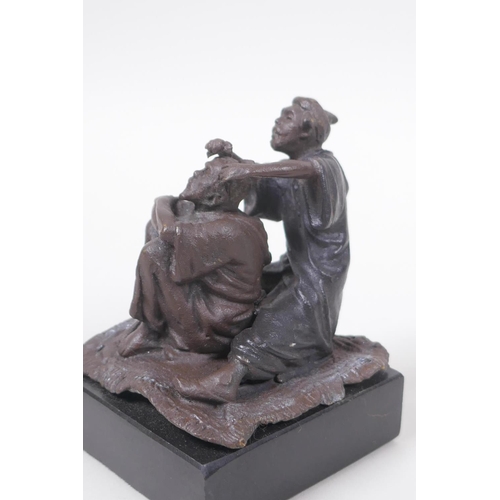 32 - A Bergman style bronze figure of an Arab barber, 8cm high