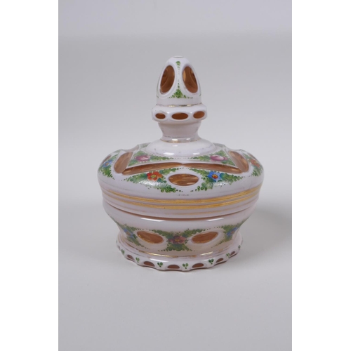 35 - A Bohemian style overlaid ruby glass vase with hand painted floral decoration, and a similar pot and... 