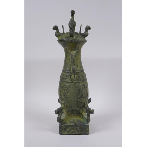 36 - A Chinese archaic style bronze vase and cover with two kylin handles and decoration with mythical cr... 