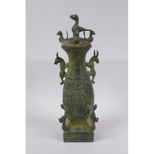 36 - A Chinese archaic style bronze vase and cover with two kylin handles and decoration with mythical cr... 