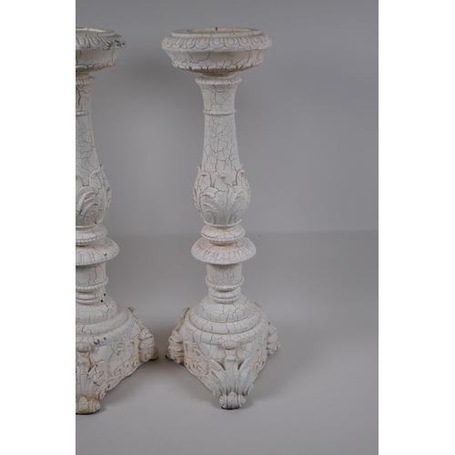 39 - A pair of painted composition pricket candlesticks, 54cm high