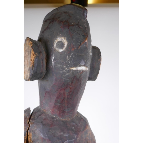 42 - A naive African carved wood tribal figure, 92cm high, AF