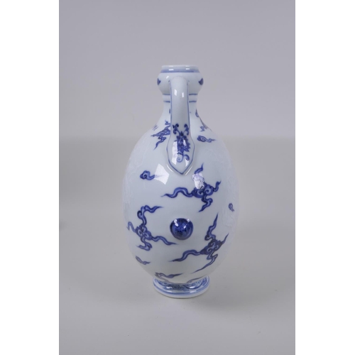 45 - A blue and white porcelain two handled mon flask with dragon decoration, Chinese Xuande 6 character ... 