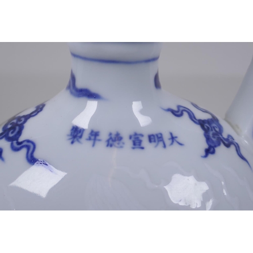 45 - A blue and white porcelain two handled mon flask with dragon decoration, Chinese Xuande 6 character ... 