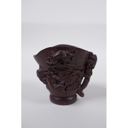 48 - A Chinese bamboo libation cup with kylin decoration, impressed seal mark to base, 8cm high