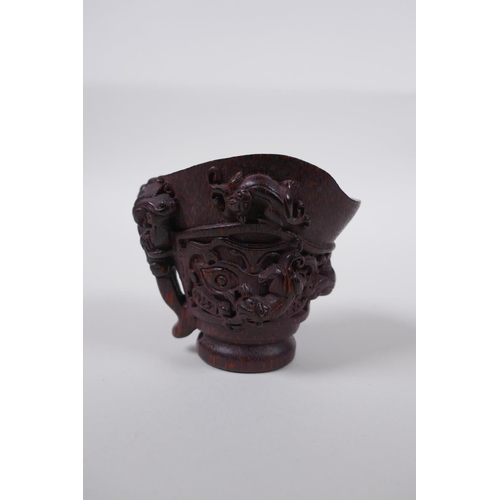 48 - A Chinese bamboo libation cup with kylin decoration, impressed seal mark to base, 8cm high