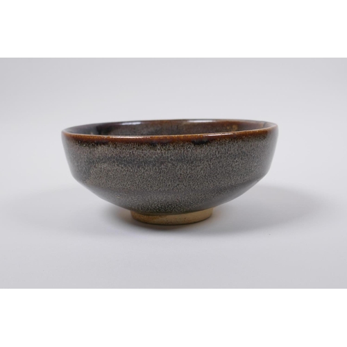 50 - A Chinese Cizhou kiln bowl with treacle speckled glaze, indistinct impressed seal mark to base, 15cm... 