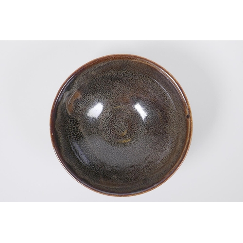 50 - A Chinese Cizhou kiln bowl with treacle speckled glaze, indistinct impressed seal mark to base, 15cm... 