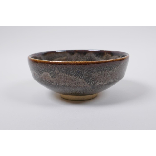 50 - A Chinese Cizhou kiln bowl with treacle speckled glaze, indistinct impressed seal mark to base, 15cm... 