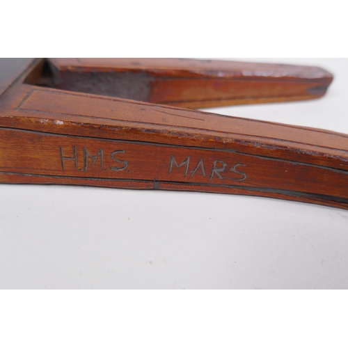 57 - An antique walnut nut cracker with copper plates, inscribed, 19cm long