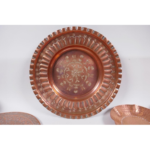 62 - A large quantity of oriental metal wares including a bidri ware bowl, copper dishes, brass dishes an... 