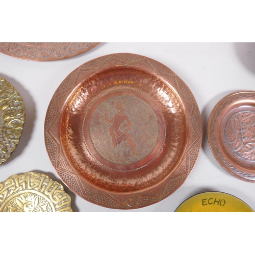 62 - A large quantity of oriental metal wares including a bidri ware bowl, copper dishes, brass dishes an... 