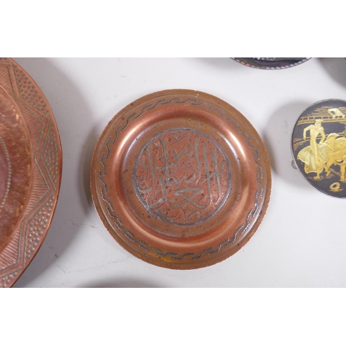 62 - A large quantity of oriental metal wares including a bidri ware bowl, copper dishes, brass dishes an... 