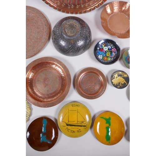 62 - A large quantity of oriental metal wares including a bidri ware bowl, copper dishes, brass dishes an... 