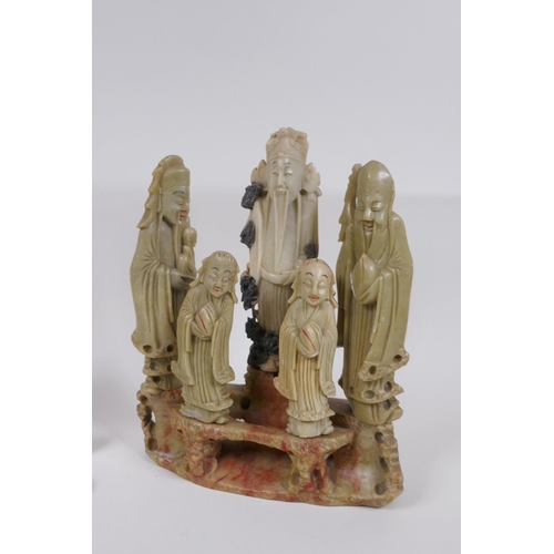 65 - Two Chinese carved soapstone figure groups depicting Fu, Lu and Shou, some dowels AF, largest 22cm