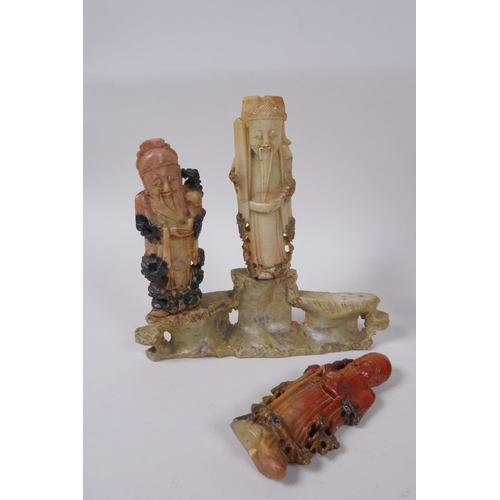 65 - Two Chinese carved soapstone figure groups depicting Fu, Lu and Shou, some dowels AF, largest 22cm