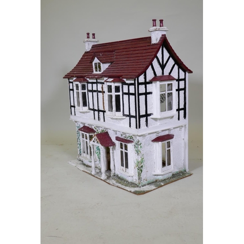 66 - A scratch built dolls' house cottage, 68 x 42cm, 77cm high