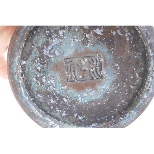 68 - A Chinese bronze brush pot with engraved kylin decoration, impressed mark to base, 12c, jogj