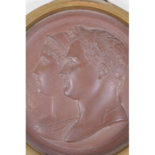 7 - A C19th painted lead plaque of Napoleon and Josephine, signed Andreiu Fecit, circa 1810, 16cm diamet... 