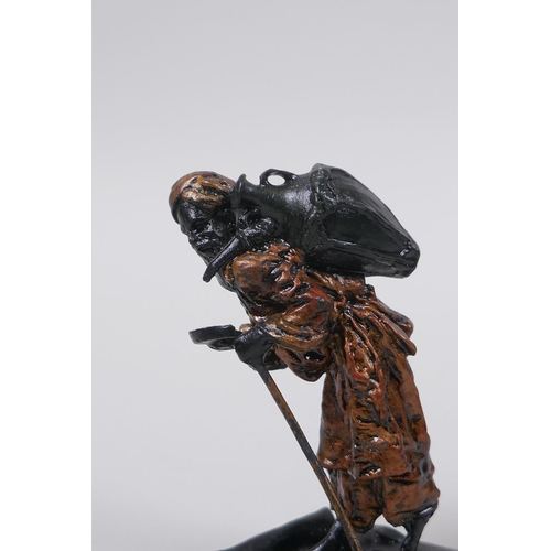 74 - A Bergman style cold painted bronze of an Arab watercarrier, 8cm high