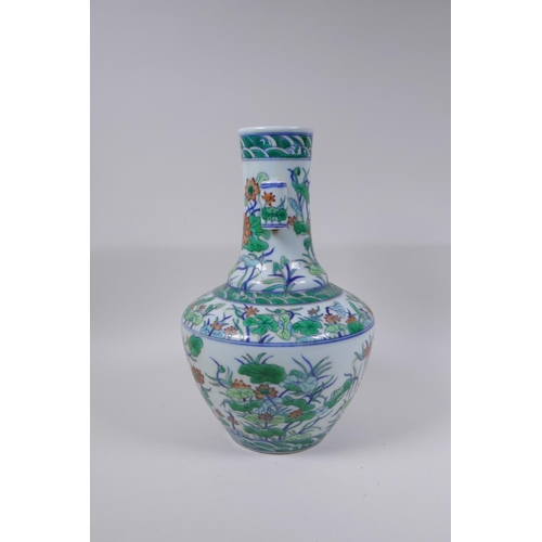 75 - A doucai porcelain vase with two lug handles and lotus flower decoration, Chinese Qianlong seal mark... 