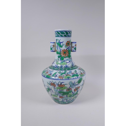 75 - A doucai porcelain vase with two lug handles and lotus flower decoration, Chinese Qianlong seal mark... 