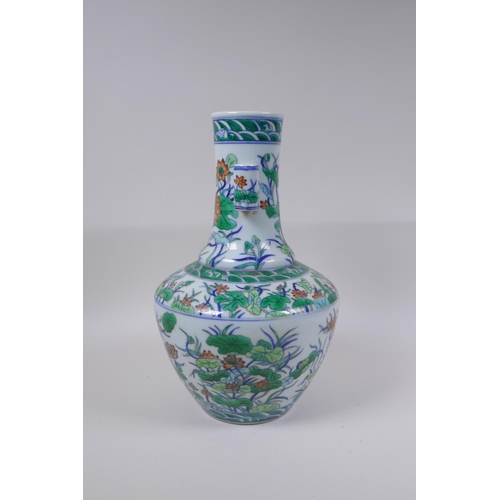 75 - A doucai porcelain vase with two lug handles and lotus flower decoration, Chinese Qianlong seal mark... 