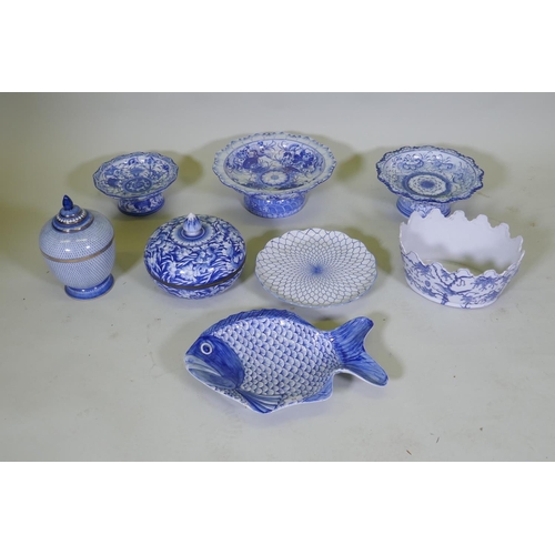 82 - A collection of oriental porcelain with blue and white decoration, including footed bowls, jars and ... 