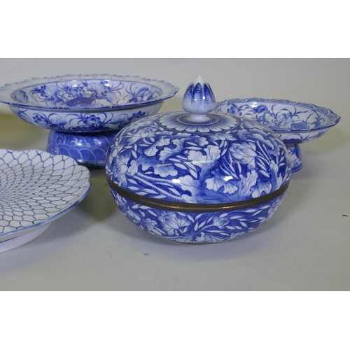 82 - A collection of oriental porcelain with blue and white decoration, including footed bowls, jars and ... 