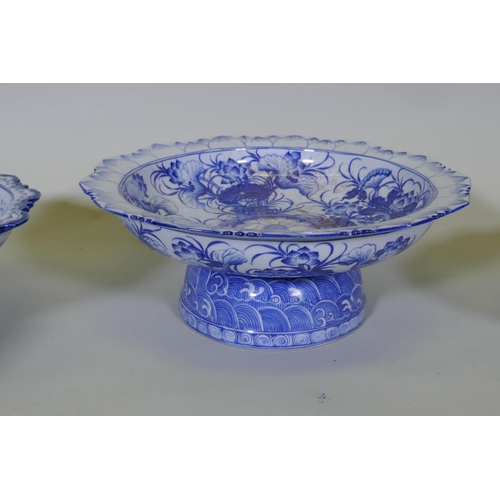 82 - A collection of oriental porcelain with blue and white decoration, including footed bowls, jars and ... 