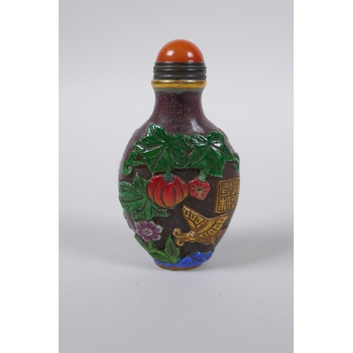 83 - A Peking glass snuff bottle with carved, enamelled and gilt bird decoration, 8cm high