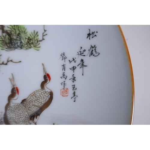 85 - A Chinese Republic style porcelain cabinet plate decorated with red crowned cranes, inscription to t... 