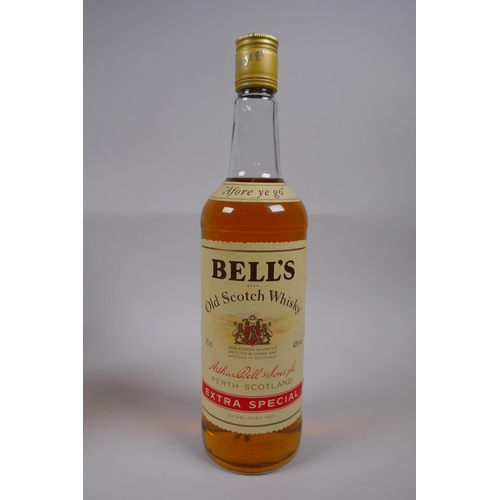 87 - A bottle of 12 year old Chivas Regal Premium Scotch Whisky, 1 litre, and a bottle of Bell's Old Scot... 