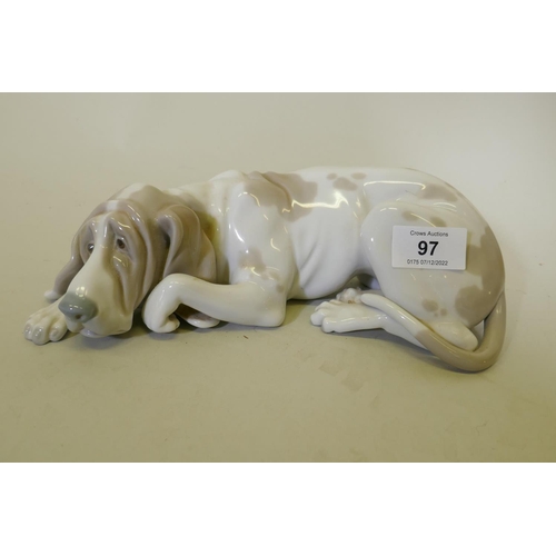 97 - A Lladro ceramic figure of a dog, 23cm long