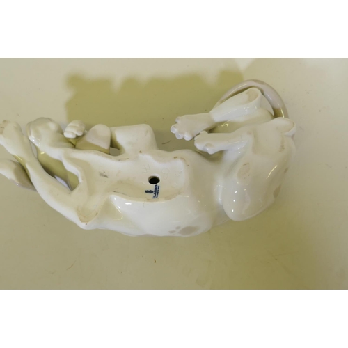 97 - A Lladro ceramic figure of a dog, 23cm long