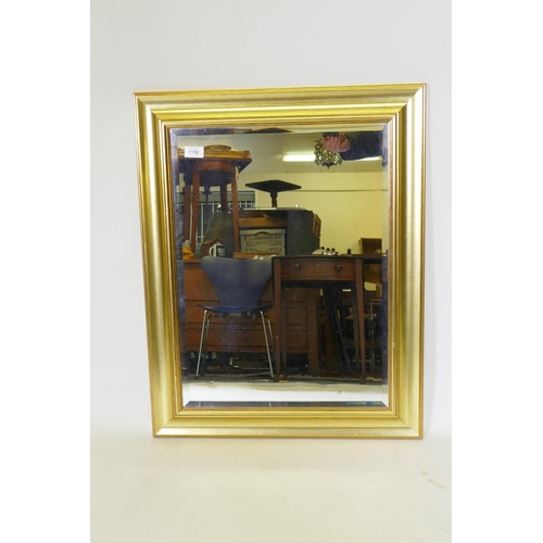 1120 - A contemporary gilt framed wall mirror with bevelled glass, 59 x 76cm