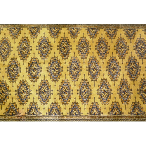 1106 - A gold ground Bokhara rug, 120 x 190cm