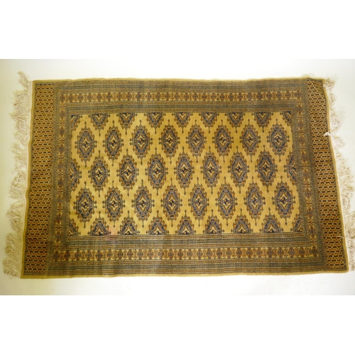 1106 - A gold ground Bokhara rug, 120 x 190cm