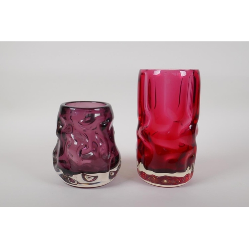 298 - An amethyst studio glass vase and a similar cranberry studio glass vase, largest 7½