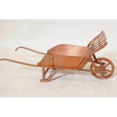 244 - A well constructed copper model of a wheelbarrow, 17