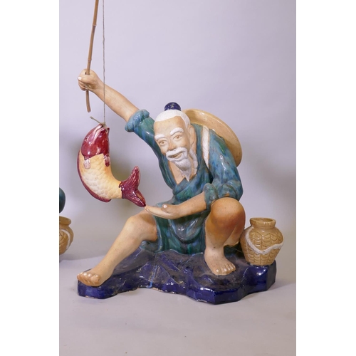 289 - A pair of oversized Chinese 'mudmen' glazed  terracotta figures of fishermen, 80cm high