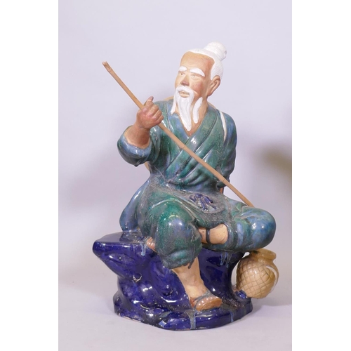 289 - A pair of oversized Chinese 'mudmen' glazed  terracotta figures of fishermen, 80cm high