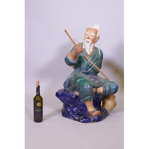 289 - A pair of oversized Chinese 'mudmen' glazed  terracotta figures of fishermen, 80cm high