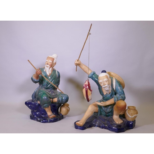 289 - A pair of oversized Chinese 'mudmen' glazed  terracotta figures of fishermen, 80cm high