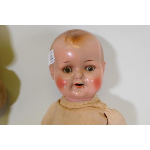 249 - An antique composition head doll with rolling eyes, marked RII and another with painted face marked ... 