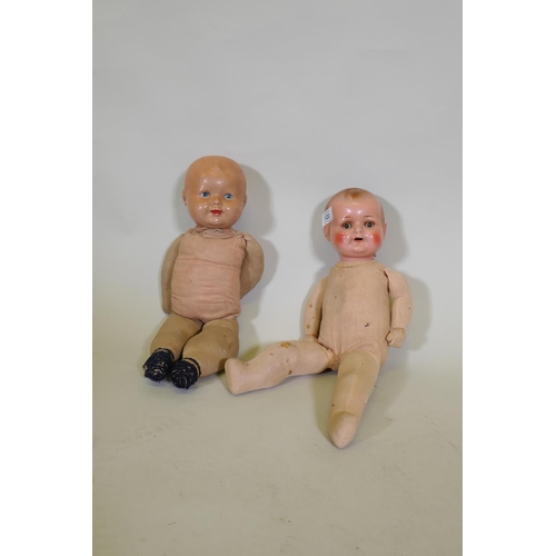 249 - An antique composition head doll with rolling eyes, marked RII and another with painted face marked ... 